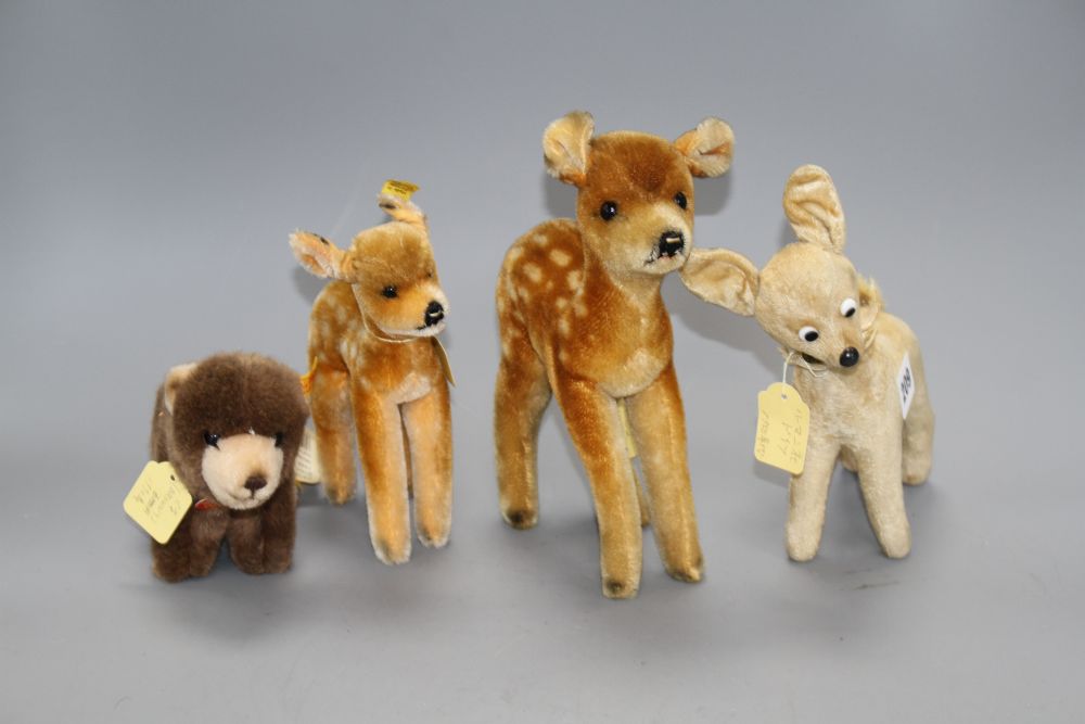 A Steiff Browny bear, a 1950s Steiff deer and two other deer